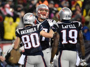 Patriots tight end Rob Gronkowski (centre) celebrates with teammates Danny Amendola (80) and Brandon LaFell (19) after scoring a touchdown against the Colts in the AFC Championship Game in Foxborough, Mass., on Sunday, Jan. 18, 2015. (Robert Deutsch/USA TODAY Sports)