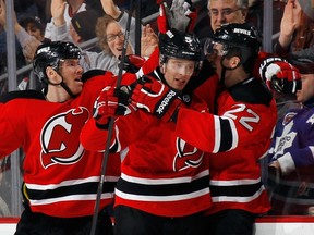 Devils defenceman Adam Larsson celebrates his game-tying goal against the Leafs on Wednesday. (AFP)