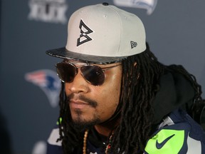 Seahawks running back Marshawn Lynch spoke with reporters during a press conference at Arizona Grand in Phoenix on Wednesday, Jan. 28, 2015. (Peter Casey/USA TODAY Sports)