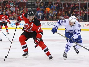 New Jersey Devils left wing Patrik Elias skates with the puck while being defended by Toronto Maple Leafs defenseman Morgan Rielly  during the second period at Prudential Center on Thursday, Jan. 29, 2015. (USA Today Sports)