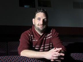 Matt Salton, the festival’s executive director, makes final preparations at The Screening Room for the start of the Reelout 16 Queer Film and Video Fest. The festival continues until Feb. 7. (Julia McKay/The Whig-Standard)