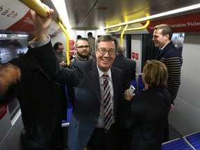 Mayor Jim Watson unveils the future of transit in Ottawa - a full-sized mock-up of the Alstom Citadis Spirit light rail vehicle that will be used on the O-Train Confederation Line, the backbone of Ottawa’s new light rail transit system. Beginning January 30, the vehicle will be on public display in the Aberdeen Pavilion at Lansdowne Park seven days a week, from 8 a.m. to 8 p.m., until the end of March. Mayor Jim Watson checks out the new train in Ottawa Thursday Jan 29,  2015.  Tony Caldwell/Ottawa Sun/QMI Agency