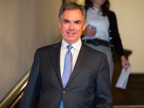 Alberta Premier Jim Prentice arrives to a media conference to take questions after a Progressive Conservative Party caucus meeting at Government House in Edmonton, Alta., on Wednesday, Jan. 28, 2015. Prentice answered questions regarding the economy, school lotteries, politics and the party. Ian Kucerak/Edmonton Sun