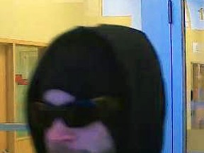 Surveillance footage of a man police believe is wanted for a streak of armed bank robberies across Western Canada. (Handout)
