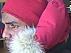 Investigators need help identifying and locating this man, who is believed to have committed a violent robbery while armed with a machete earlier this week in Scarborough. PHOTO COURTESY OF TORONTO POLICE