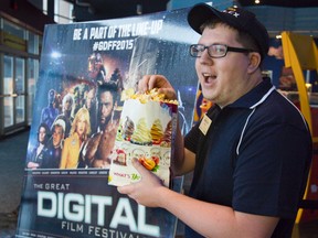 SilverCity employee Kyle Morin had better save some of that popcorn for the many movie buffs expected to show up for The Great Digital Film Festival, which runs for seven days at the Masonville Place cinema. (DEREK RUTTAN, The London Free Press)