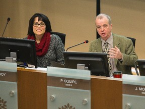 Councillors Maureen Cassidy, left, and Phil Squire participate in budget deliberations at city hall  in London Thursday. DEREK RUTTAN/ The London Free Press /QMI AGENCY