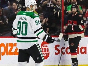 Former Ottawa Senators captain Jason Spezza skates past a "Welcome Back Spezza" sign during NHL hockey action at the Canadian Tire Centre in Ottawa Jan. 29, 2015. (Errol McGihon/Ottawa Sun/QMI Agency)