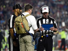 NFL referee John Parry watches a replay during the Pro Bowl at University of Phoenix Stadium on Sunday, Jan. 25, 2015. (Kyle Terada/USA TODAY Sports)