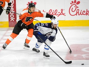Mathieu Perreault skates past Philadelphia Flyers defenceman Luke Schenn. (ERIC HARTLINE/USA Today Sports)