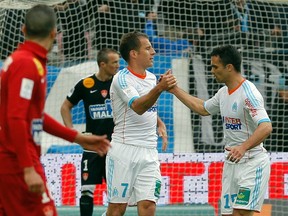 Toronto FC has signed French midfielder Benoit Cheyrou (middle). (REUTERS)