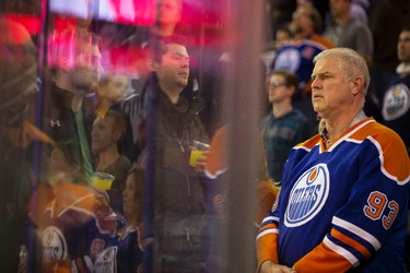 Edmonton fans are seen during the singing of Oh Canada  before the first period of a NHL hockey game between the Edmonton Oilers and the Buffalo Sabres at Rexall Place in Edmonton, Alta., on Thursday, Jan. 29, 2015. Ian Kucerak/Edmonton Sun/ QMI Agency