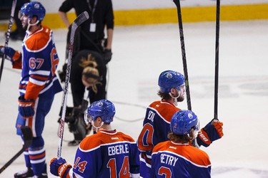 Edmonton players salute the crowd after beating Buffalo 3-2 during a NHL hockey game between the Edmonton Oilers and the Buffalo Sabres at Rexall Place in Edmonton, Alta., on Thursday, Jan. 29, 2015. Ian Kucerak/Edmonton Sun/ QMI Agency