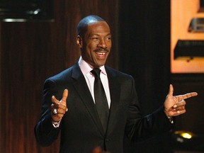 Actor Eddie Murphy gestures as he is welcomed on stage during the taping of the Spike TV special tribute "Eddie Murphy: One Night Only" in Beverly Hills, Calif., on Nov. 3, 2012. (REUTERS/Mario Anzuoni)