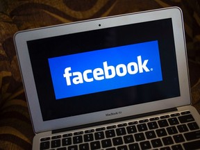 A Facebook logo is shown on a notebook in this Dec. 21, 2013 file photo. (REUTERS/Eric Thayer/Files)