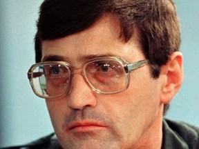 Apartheid death-squad leader Eugene de Kock listens to questions put to him by lawyers at the special public hearing of South Africa's Truth and Reconciliation Commission in Johannesburg in this Jan. 29, 1998 file photo. (REUTERS/Peter Andrews/Files)