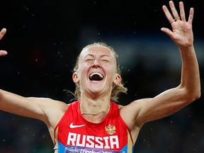 Russia's Yulia Zaripova reacts as she wins the women's 3000m steeplechase final at the London 2012 Olympic Games. (REUTERS/Lucy Nicholson)