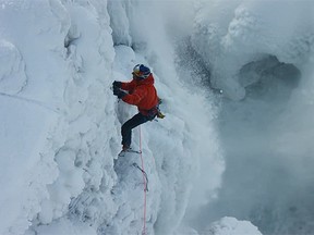 Canadians Will Gadd, 47, and Sarah Hueniken, 34, scaled the 15-storey icy, jagged U.S. side of Horseshoe Falls on Tuesday for a Red Bull-sponsored film project. (Red Bull/YouTube screengrab)