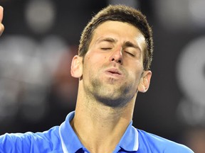 Serbia's Novak Djokovic celebrates after victory in his men's singles semi-final match against Switzerland's Stanislas Wawrinka in the Australian Open. (AFP PHOTO / PAUL CROCK)