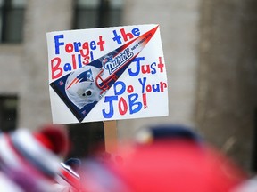 BOSTON, MA - JANUARY 26: A fan holds a sign referencing