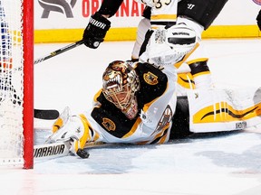 Tuukka Rask of the Boston Bruins makes a save against the New York Islanders during their game at the Nassau Veterans Memorial Coliseum January 29, 2015 in Uniondale, N.Y. (Al Bello/Getty Images/AFP)