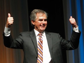 Jim Prentice salutes the crowd as they cheers for him after he was announced as the winner of the 2014 Progressive Conservative Association of Alberta leadership election at Northlands Expo Centre in Edmonton, Alta., on Saturday, Sept 6, 2014. Tom Braid/Edmonton Sun
