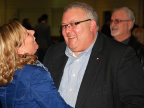 Karen Vecchio, left, shares a laugh with Elgin-Middlesex-London MP Joe Preston at St. Joseph's Catholic High School in St. Thomas last December, after Vecchio won the riding's Conservative nomination for the next federal election. (Ben Forrest, Times-Journal)