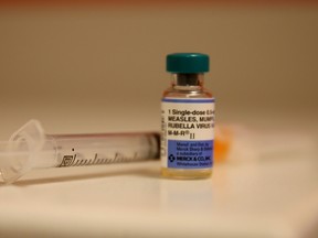In this photo illustration, a bottle containing a measles vaccine is seen at the Miami Children's Hospital on January 28, 2015 in Miami, Florida. A recent outbreak of measles has some doctors encouraging vaccination as the best way to prevent measles and its spread. (Photo illustration by Joe Raedle/Getty Images/AFP