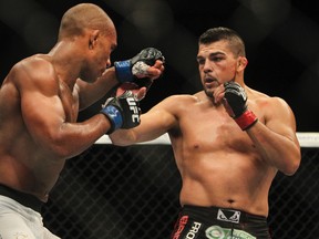 Kelvin Gastelum (red gloves) fights Nico Musoke (blue gloves) in a Welterweight bout at UFC Fight Night 43 at AT&T Center on June 28, 2014. (Troy Taormina/USA TODAY Sports)