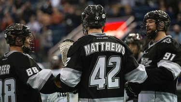 The Edmonton Rush's Zack Greer (88), Mark Matthews (42), and Cory conway (91) celebrate Matthews' goal against the New England Black Wolves during second half NLL action at Rexall Place, in Edmonton Alta., on Friday Jan. 30, 2015. David Bloom/Edmonton Sun/QMI Agency