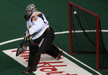 The Edmonton Rush Chris Corbeil's (not pictured) shot gets past the New England Black Wolves' Evan Kirk (35) during first half NLL action at Rexall Place, in Edmonton Alta., on Friday Jan. 30, 2015. David Bloom/Edmonton Sun/QMI Agency