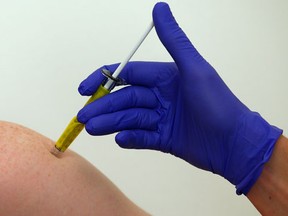 A volunteer receives a trial Ebola vaccine at the Centre for Clinical Vaccinology and Tropical Medicine in Oxford, southern England January 16, 2015. REUTERS/Eddie Keogh
