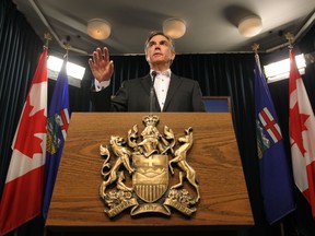 Premier Jim Prentice announces that the Cabinet will take a 5% pay cut with the MLAs to follow suit during a news conference at the Alberta Legislature in Edmonton, Alberta  Jan.29, 2015. Perry Mah/ QMI Agency