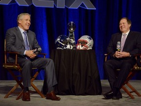 Seattle Seahawks coach Pete Carroll (left) and New England Patriots coach Bill Belichick laugh during a press conference for Super Bowl XLIX at Phoenix Convention Center. (Kirby Lee/USA TODAY Sports)