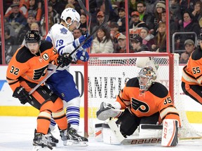Flyers defenceman Mark Streit (left) ties up Maple Leafs winger Joffrey Lupul in front of goalie Steve Mason during the first period at Wells Fargo Center in Philadelphia on Saturday night. The Leafs were held off the scoresheet for the fourth time in January.