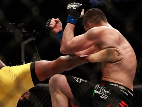 Anderson Silva (L) kicks Nick Diaz in their middleweight bout during UFC 183. Silva won by unanimous decision. (Steve Marcus/Getty Images/AFP)