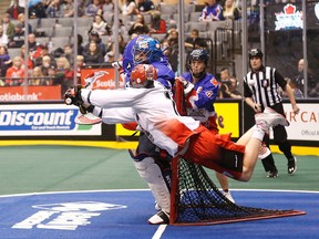 Curtis Dickson of the Calgary Roughnecks tries to beat Toronto Rock goalie Brandon Miller. (Michael Peake, Toronto Sun)