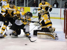 Sarina Sting winger Davis Brown unsuccessfully tries to sneak the puck past Kingston Frontenacs goalie Lucas peressini at the KRock Centre in Kingston, Ont. on Saturday January 31, 2015.  Steph Crosier/Kingston Whig-Standard/QMI Agency