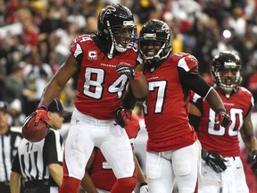 Atlanta Falcons wide receiver Roddy White (84) reacts with wide receiver Devin Hester (17) after catching a touchdown against the Pittsburgh Steelers during the second half at the Georgia Dome. (Dale Zanine-USA TODAY Sports)