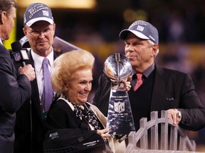New York Giants owners Steve Tisch (R) and John Mara (L) celebrate their team's win with Mara's mother Ann Mara at the end of the NFL Super Bowl XLVI football game in Indianapolis, Indiana, February 5, 2012. (REUTERS)