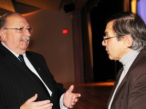 Sarnia-Lambton MPP Bob Bailey speaks with transportation expert Greg Gormick after a plan to improve rail and bus service in southwestern Ontario was unveiled on Saturday in Sarnia. Bailey was among the politicians fwho attended the session organized by rail advocacy groups. (NEIL BOWEN, The Observer)