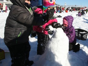 The world record for most snowmen built in an hour was broken Sunday at TD Place. Teams built 1,299 snowmen in an hour -- beating the old record of 1,279 set in Salt Lake City in 2011.
DOUG HEMPSTEAD/Ottawa Sun