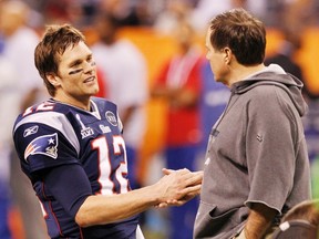 New England Patriots quarterback Tom Brady shakes hands with Patriots head coach Bill Belichick before their team plays the New York Giants in Super Bowl XLVI in Indianapolison February 5, 2012. (REUTERS/Mike Segar)