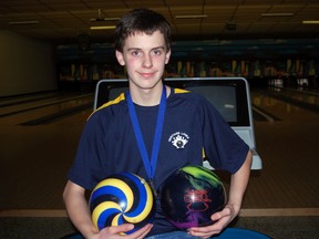 Brayden Vaughan clutches a pair of bowling balls at Heritage Lanes, his home alley in St. Thomas. Vaughan is the first male bowler from St. Thomas to win his division in the Ivan Nelson Memorial Youth Championship, an annual tournament that draws bowlers from all over southern Ontario. He also landed a spot on the southern Ontario team competing at the Canadian Tenpin Federation Nationals in Winnipeg in May. (Ben Forrest, Times-Journal)