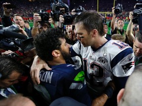 New England Patriots quarterback Tom Brady greets Seattle Seahawks quarterback Russell Wilson after Super Bowl XLIX at University of Phoenix Stadium on Feb. 1, 2015. (Mark J. Rebilas/USA TODAY Sports)