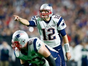 Tom Brady of the New England Patriots signals in the second half against the Seattle Seahawks during Super Bowl XLIX at University of Phoenix Stadium on February 1, 2015. (Kevin C. Cox/Getty Images/AFP)