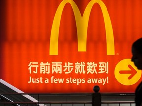 A woman walks past a logo of McDonald's in Hong Kong.

REUTERS/Tyrone Siu/Files