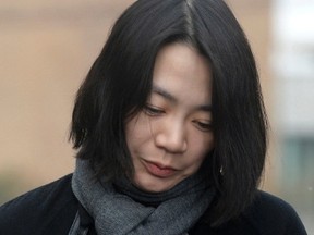 Cho Hyun-ah, also known as Heather Cho, daughter of chairman of Korean Air Lines, Cho Yang-ho, appears in front of the media outside the offices of the Aviation and Railway Accident Investigation Board of the Ministry of Land, Infrastructure, Transport, in Seoul December 12, 2014. (REUTERS/Song Eun-seok/News1)