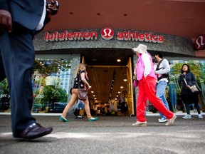 People walk past a store of yogawear retailer Lululemon Athletica in downtown Vancouver, in this file photo taken June 11, 2014.    REUTERS/Ben Nelms/Files