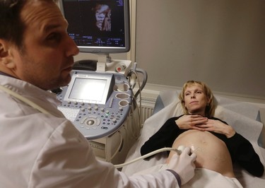 Doctor Marek Sois looks at the ultrasound scan of mother-to-be Maarja Lants' unborn baby Tallinn, Estonia, Jan. 28, 2015. An Estonian 3D technology company has found a way how to make pregnancy more exciting, giving parents and loved ones the opportunity to touch their baby before it is even born by printing out 3D fetus models.  REUTERS/Ints Kalnins